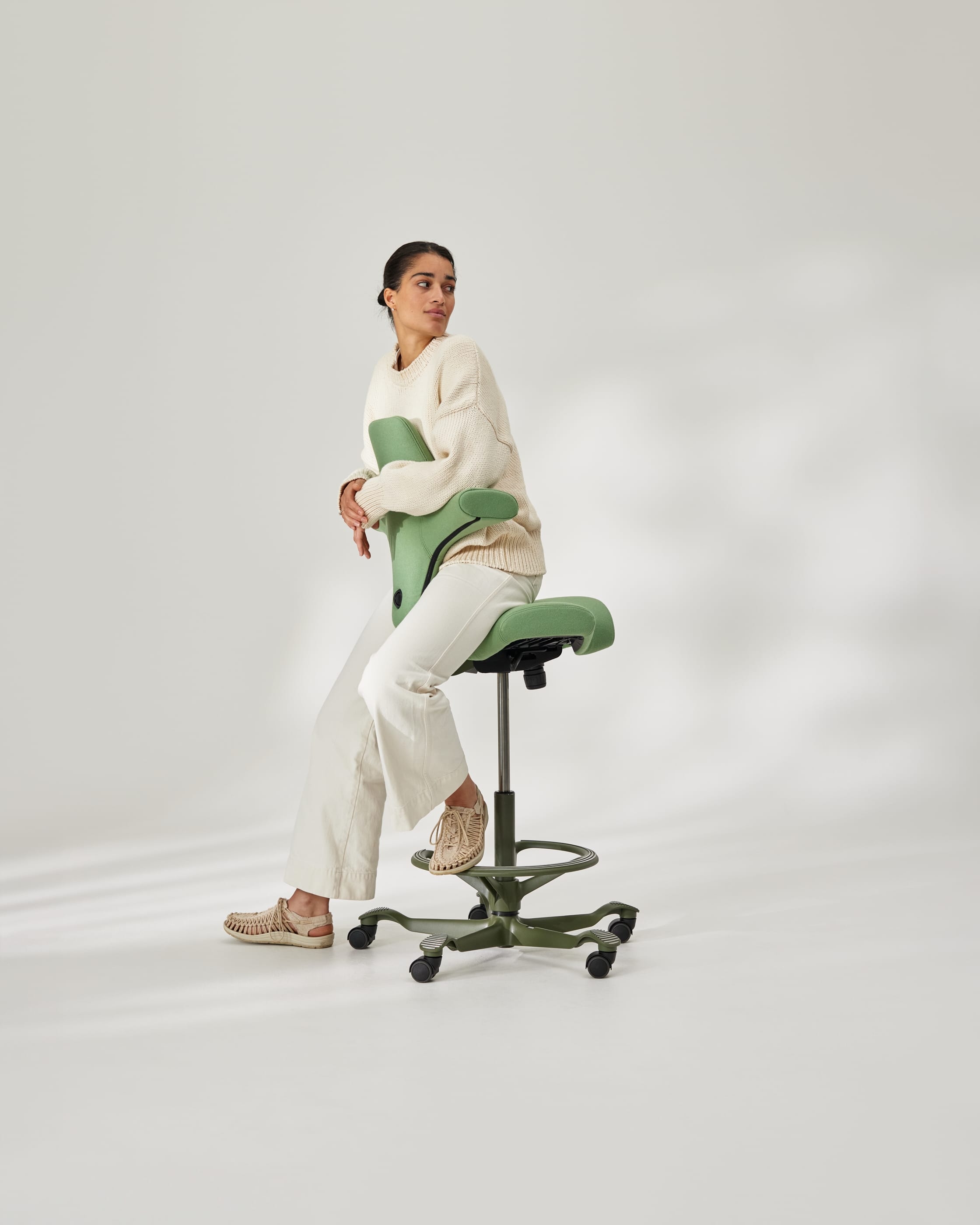 HAG Capisco chair with HAG FootRing in a warm, residential interior
